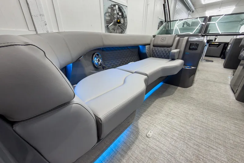 Slide: The Image of Luxurious interior of 2026 Godfrey Sanpan 27' Tritoon with plush seating and ambient lighting. - 15