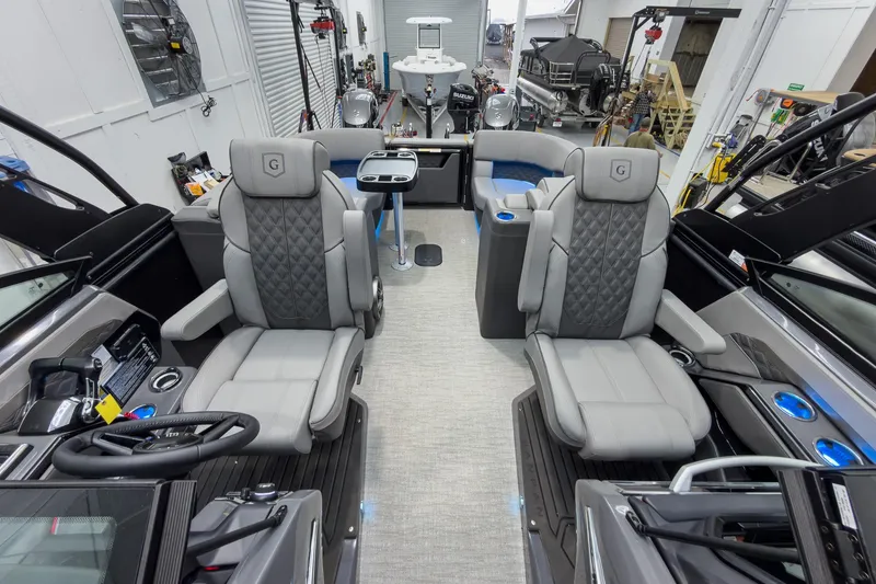 Slide: The Image of Luxurious interior of 2026 Godfrey Sanpan 27' Tritoon with plush seating and modern design. - 19