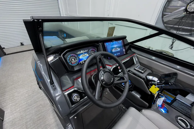 Slide: The Image of Interior view of 2026 Godfrey Sanpan 27' Tritoon dashboard with modern controls and displays. - 20