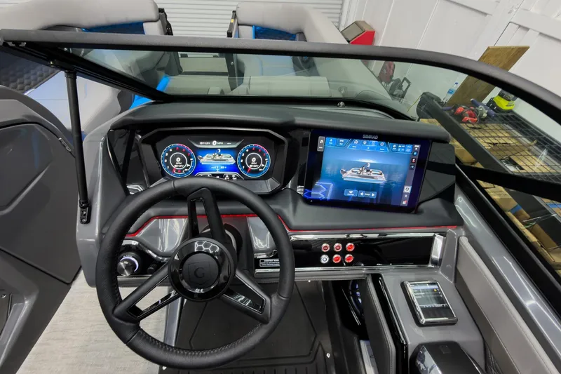 Slide: The Image of Interior dashboard of 2026 Godfrey Sanpan 27' Tritoon with advanced controls and displays. - 21