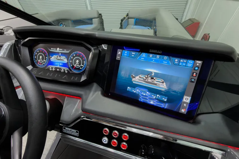 Slide: The Image of Dashboard of 2026 Godfrey Sanpan 27' Tritoon with digital displays and controls. - 22