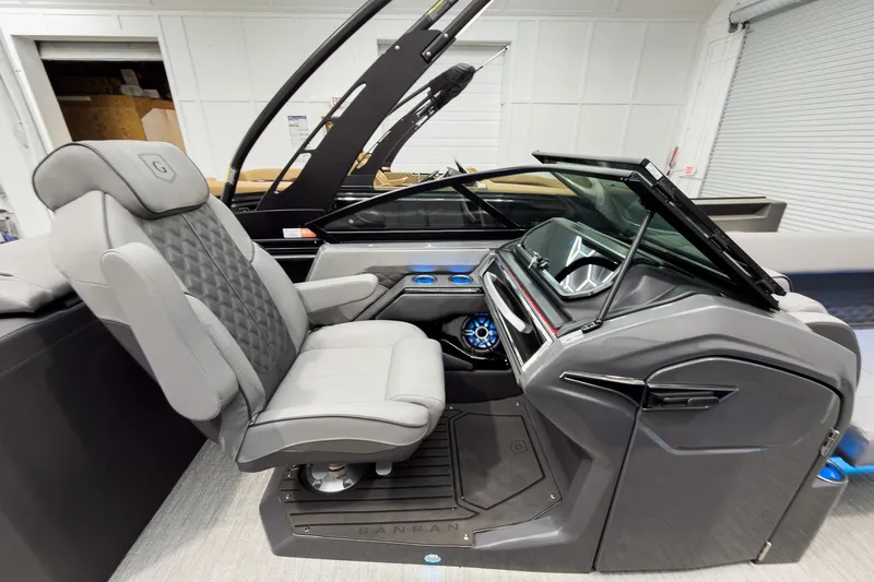 Slide: The Image of Luxurious interior of 2026 Godfrey Sanpan 27' Tritoon with modern helm and seating. - 27