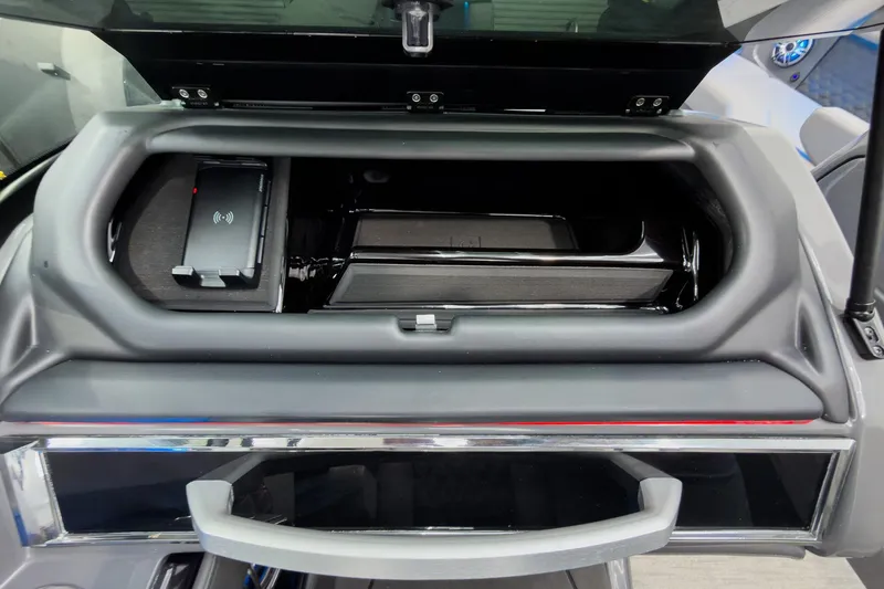 Slide: The Image of Storage compartment of 2026 Godfrey Sanpan 27' Tritoon with wireless charging pad. - 29