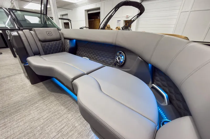 Slide: The Image of Luxurious interior of 2026 Godfrey Sanpan 27' Tritoon with plush seating and ambient lighting. - 34