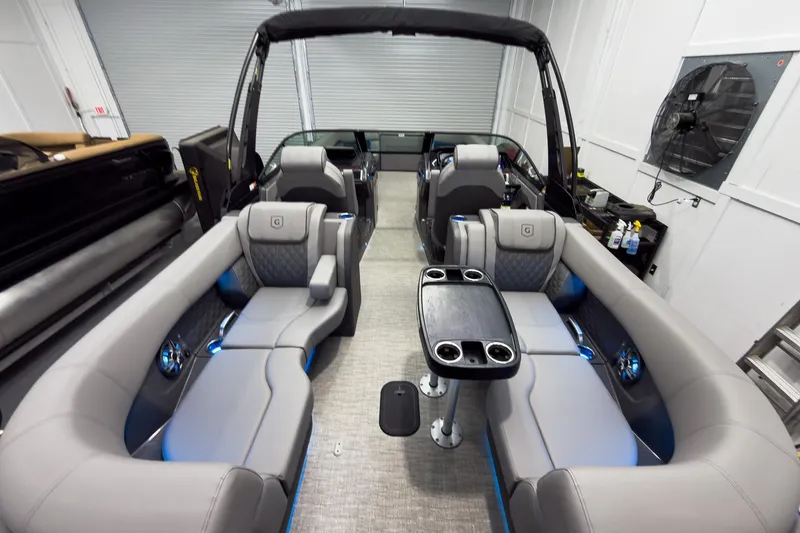 Slide: The Image of Luxurious interior of 2026 Godfrey Sanpan 27' Tritoon with plush seating and modern amenities. - 44