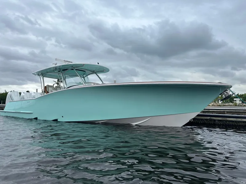 Slide: The Image of 2025 Mag Bay 38 CC boat on water under cloudy sky. - 3