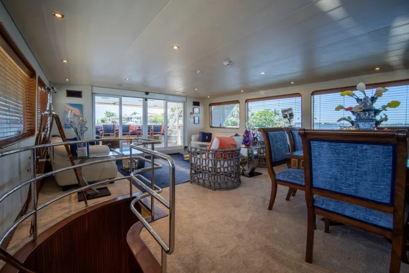Slide: The Image of Luxurious interior of 1984 Lloyds Ships Tri-Deck yacht with elegant furnishings and panoramic windows. - 15