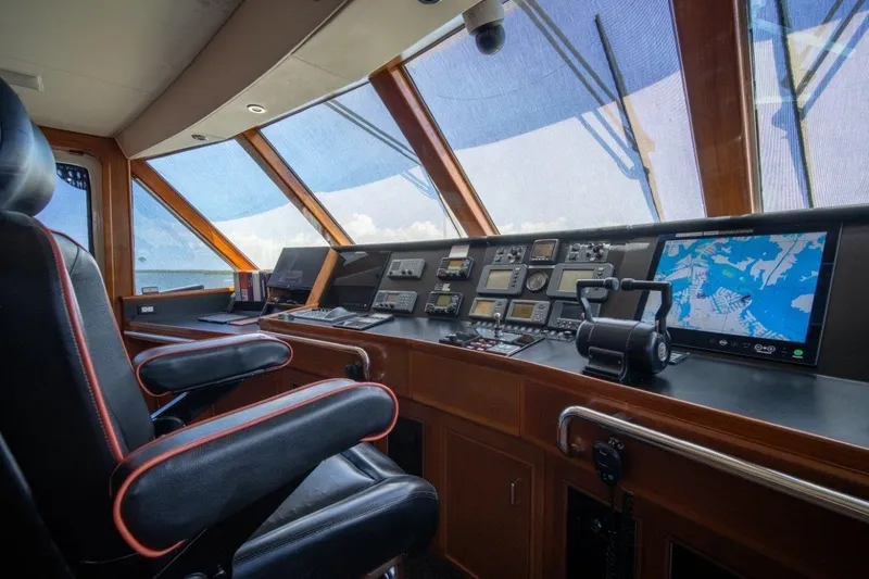 Slide: The Image of Luxurious 1984 Lloyds Ships Tri-Deck yacht bridge with navigation equipment and captain's chair. - 16