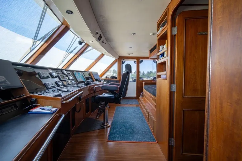 Slide: The Image of Luxurious 1984 Lloyds Ships Tri-Deck yacht interior with navigation controls and wooden finishes. - 17