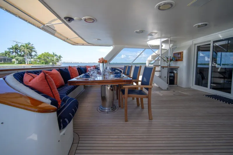 Slide: The Image of Luxurious 1984 Lloyds Ships Tri-Deck yacht deck with elegant dining area and scenic views. - 19