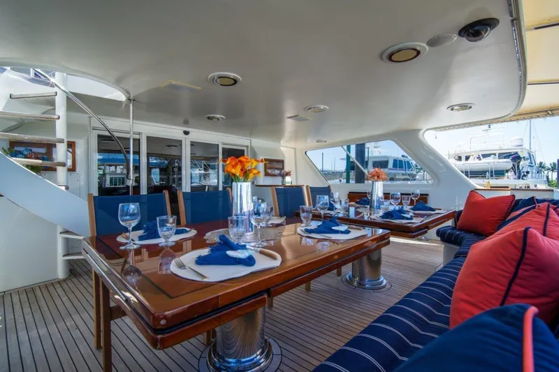 Slide: The Image of Luxurious dining area on 1984 Lloyds Ships Tri-Deck yacht, featuring elegant table settings and plush seating. - 21