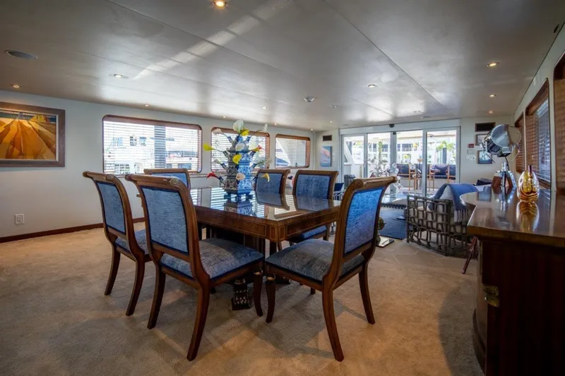 Slide: The Image of Luxurious dining area on 1984 Lloyds Ships Tri-Deck yacht, featuring elegant furnishings and decor. - 25