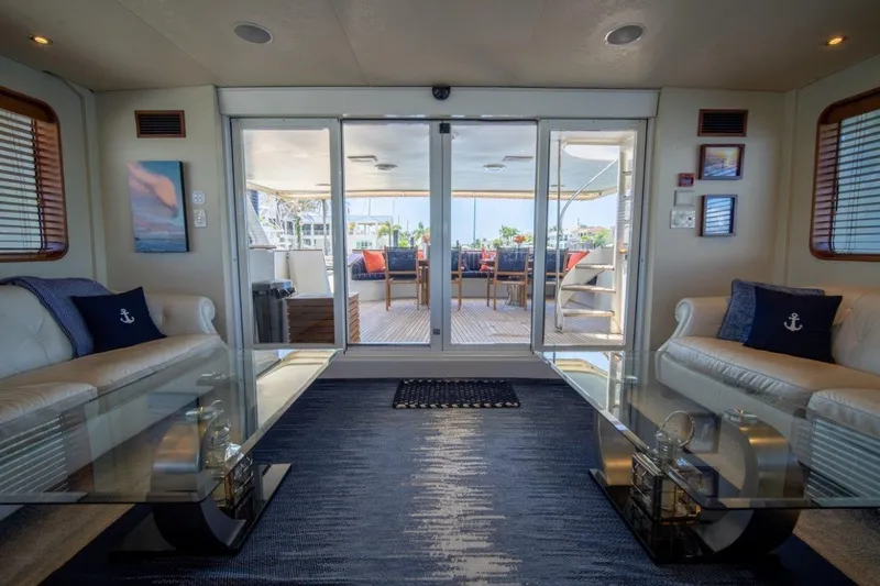 Slide: The Image of Luxurious 1984 Lloyds Ships Tri-Deck yacht interior with elegant seating and glass doors to deck. - 28