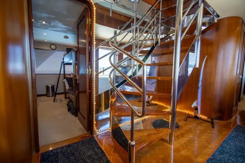 Slide: The Image of Luxurious interior of 1984 Lloyds Ships Tri-Deck yacht with elegant staircase and wood finishes. - 29