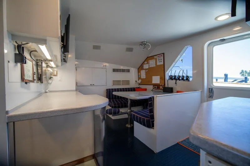 Slide: The Image of Interior of 1984 Lloyds Ships Tri-Deck yacht with seating area and communication equipment. - 31
