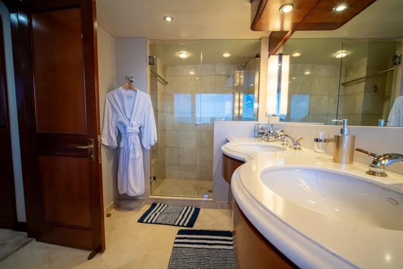 Slide: The Image of Luxurious bathroom on 1984 Lloyds Ships Tri-Deck yacht with double sinks and glass shower. - 45