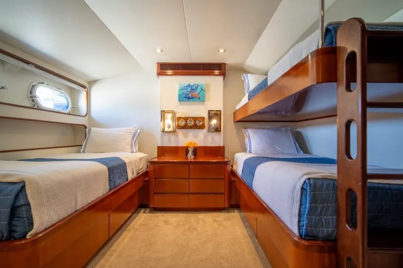 Slide: The Image of Luxurious 1984 Lloyds Ships Tri-Deck cabin with twin beds and elegant wood finishes. - 46