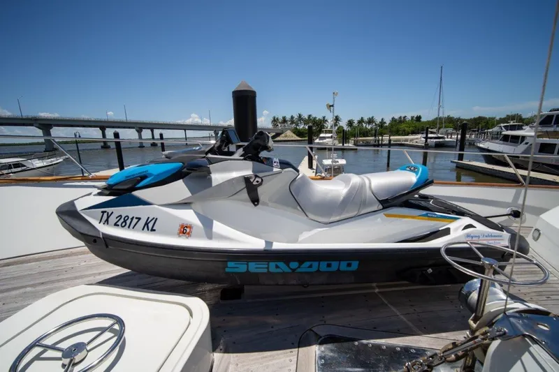 Slide: The Image of Jet ski on Lloyds Ships Tri-Deck yacht, 1984 model, docked at marina with bridge view. - 5