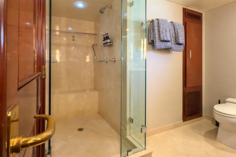 Slide: The Image of Luxurious yacht bathroom with glass shower, elegant fixtures, and plush towels, 1984 Lloyds Ships Tri-Deck. - 50