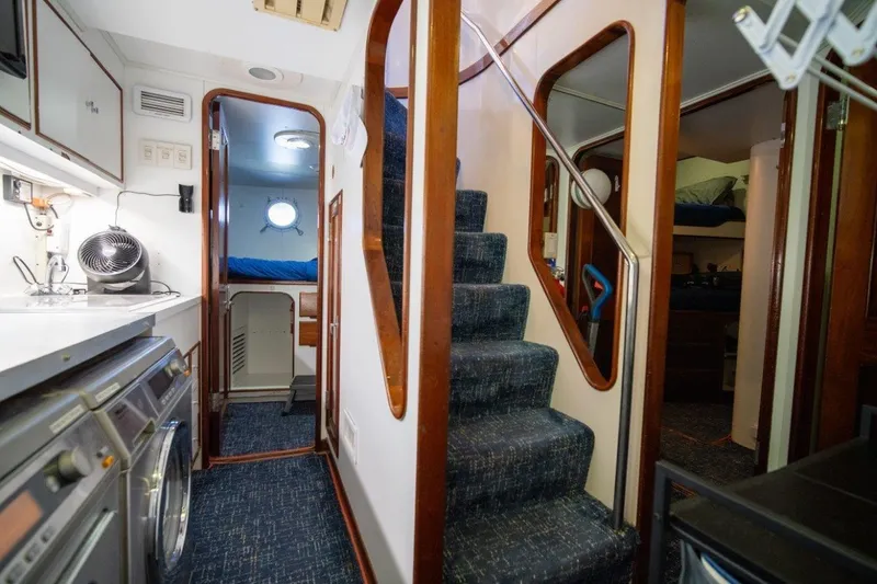 Slide: The Image of Interior of 1984 Lloyds Ships Tri-Deck yacht with stairs, cabin, and laundry area. - 52