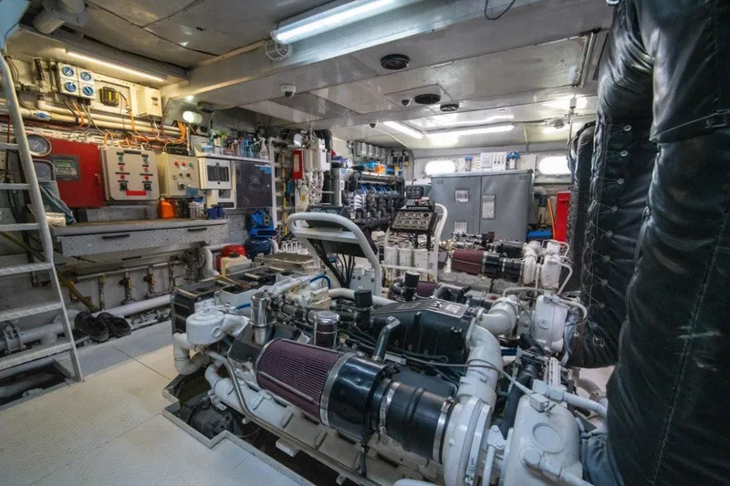 Slide: The Image of Engine room of 1984 Lloyds Ships Tri-Deck yacht, featuring complex machinery and control panels. - 57
