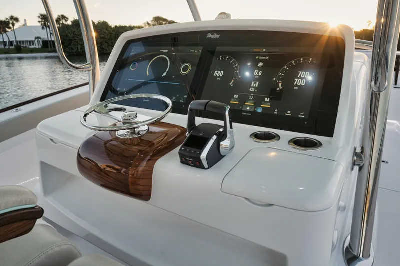 Slide: The Image of 2025 Mag Bay 43 CC boat dashboard with advanced navigation and control systems. - 12