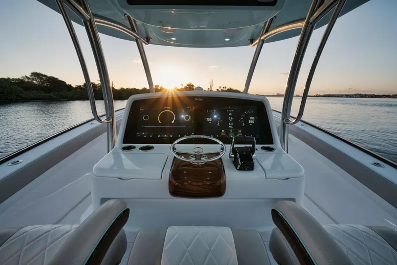 Slide: The Image of 2025 Mag Bay 43 CC boat helm with sunset view. - 13