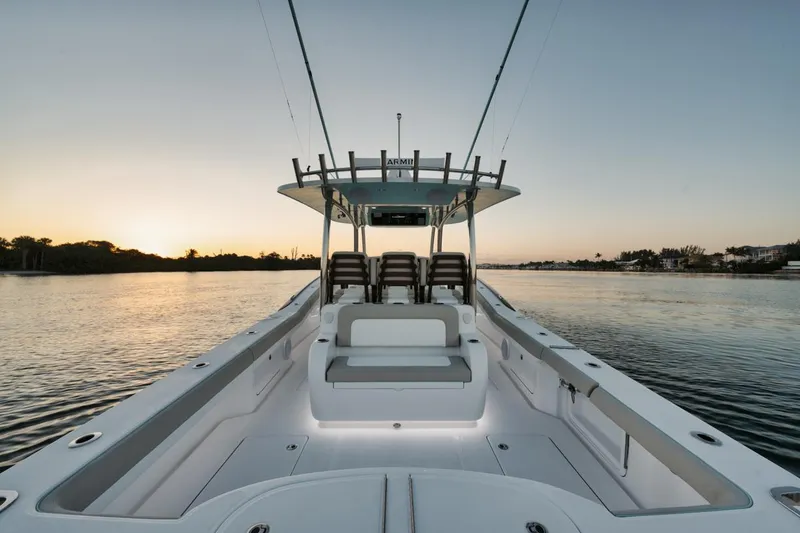 Slide: The Image of 2025 Mag Bay 43 CC boat at sunset on calm waters. - 18