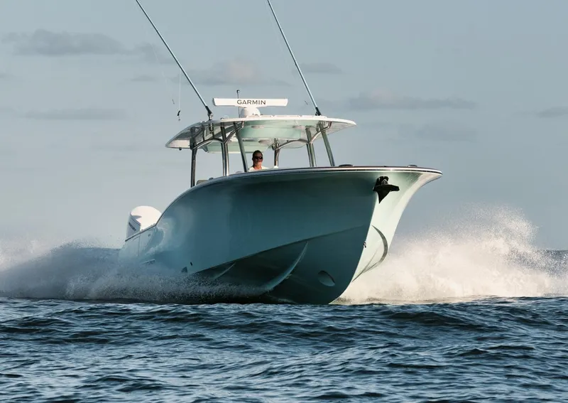 Slide: The Image of 2025 Mag Bay 43 CC boat cruising on open water. - 2