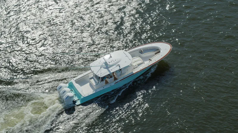 Slide: The Image of 2025 Mag Bay 43 CC boat cruising on water. - 5