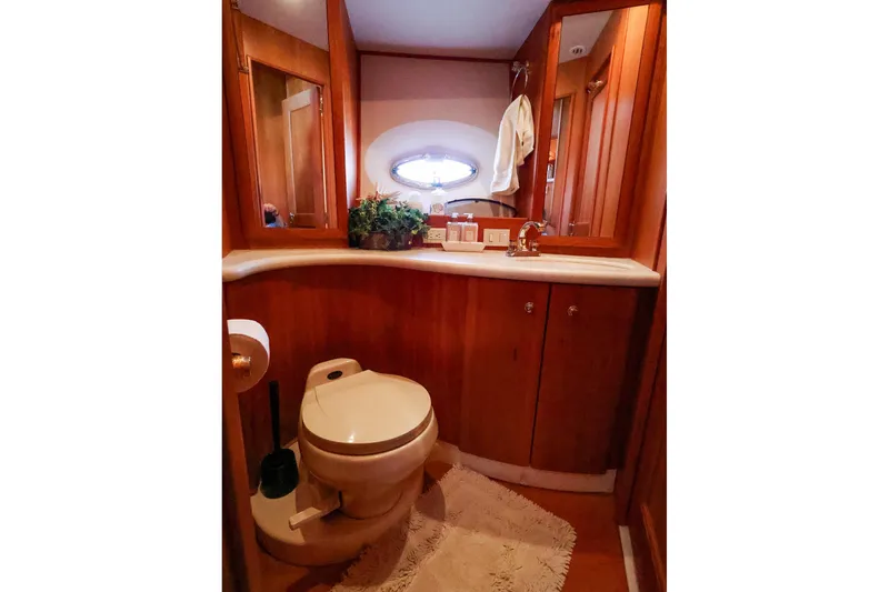 Slide: The Image of Luxurious bathroom in 2002 Silverton 43 Motor Yacht with wood cabinetry and modern fixtures. - 22