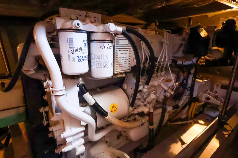 Slide: The Image of Engine room of 2002 Silverton 43 Motor Yacht with visible filters and wiring. - 28