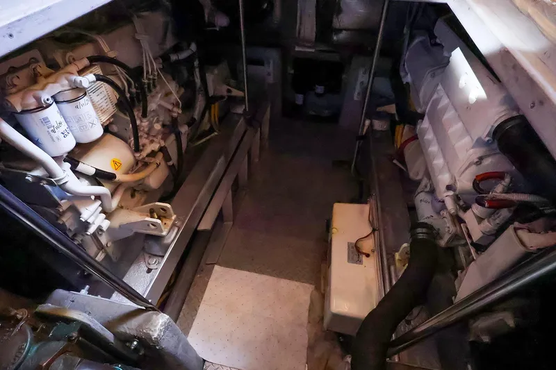 Slide: The Image of Engine room of a 2002 Silverton 43 Motor Yacht, showcasing mechanical components. - 29