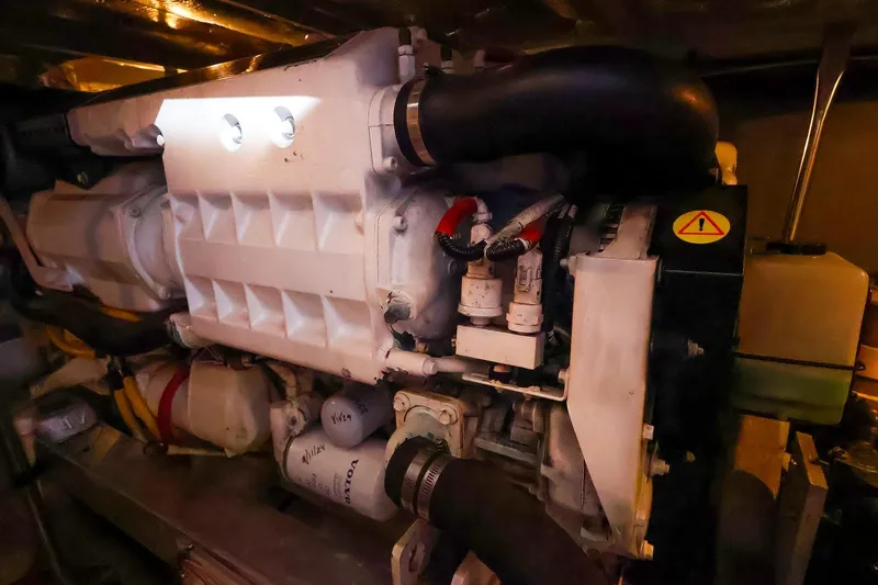 Slide: The Image of Engine room of a 2002 Silverton 43 Motor Yacht, showcasing mechanical components. - 30