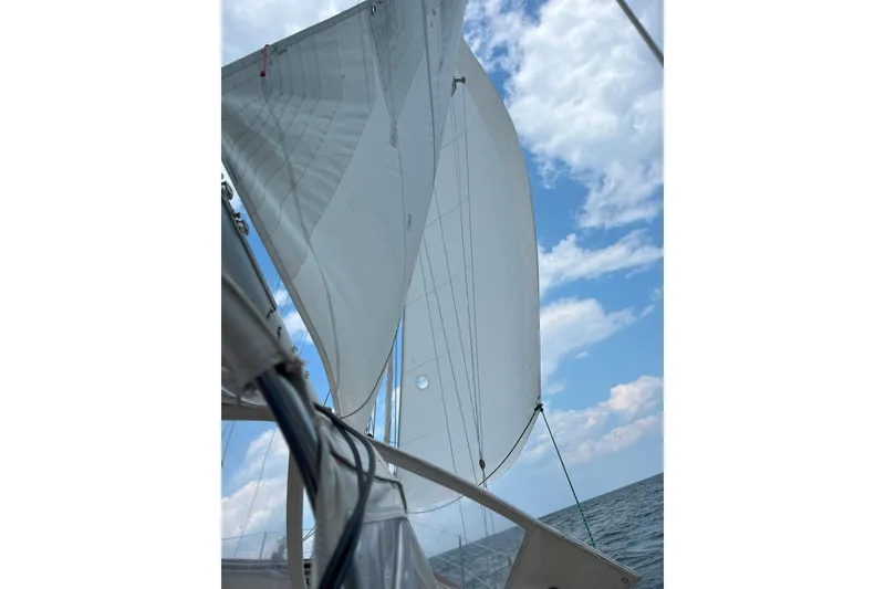 Slide: The Image of Sailing on a 1981 Shannon 38 Ketch under clear blue skies. - 10