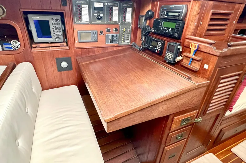 Slide: The Image of Navigation station of 1981 Shannon 38 Ketch with wooden desk and electronic equipment. - 4