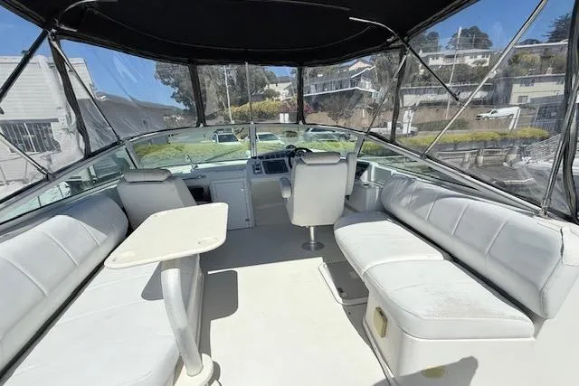 Slide: The Image of Interior of 2007 Carver 36 Mariner yacht with white seating and helm. - 10