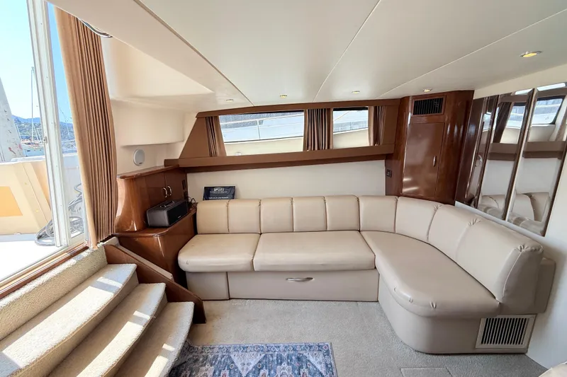 Slide: The Image of Luxurious interior of 2007 Carver 36 Mariner yacht with beige leather seating. - 15