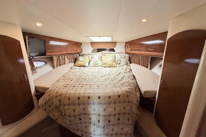 Slide: The Image of Luxurious cabin interior of 2007 Carver 36 Mariner yacht with cozy bed and wooden cabinets. - 24