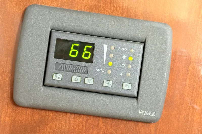 Slide: The Image of Digital thermostat on 2007 Carver 36 Mariner, displaying temperature at 66 degrees. - 29