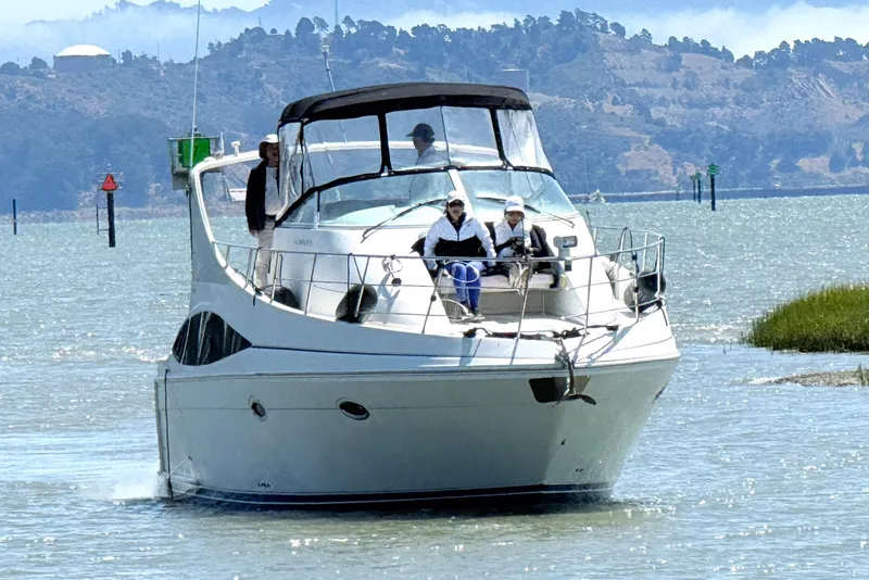 The Image of 2007 Carver 36 Mariner yacht cruising on a scenic waterway. - 0