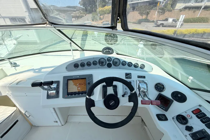 Slide: The Image of 2007 Carver 36 Mariner helm with navigation controls and steering wheel. - 5
