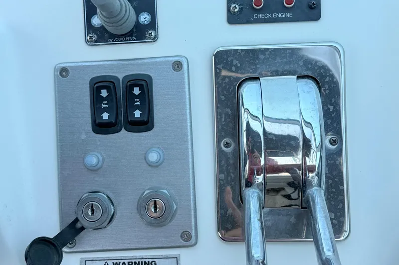 Slide: The Image of Control panel of a 2007 Carver 36 Mariner boat with switches and levers. - 7
