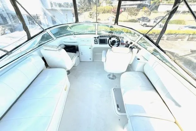 Slide: The Image of Interior view of 2007 Carver 36 Mariner yacht cockpit with white seating and control panel. - 9