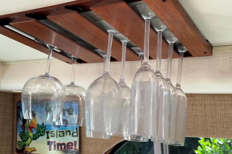 Slide: The Image of Hanging wine glasses in a 2008 Cabo 35 Flybridge boat interior. - 13