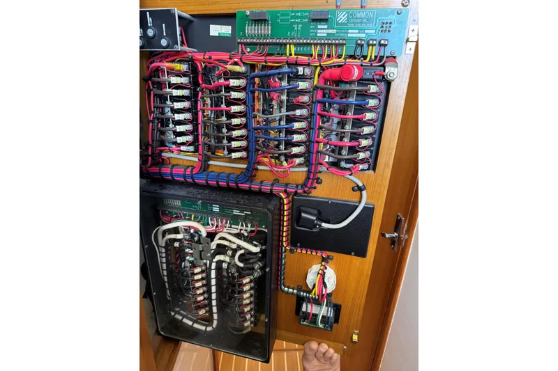 Slide: The Image of Electrical panel of a 2008 Cabo 35 Flybridge boat with organized wiring. - 17