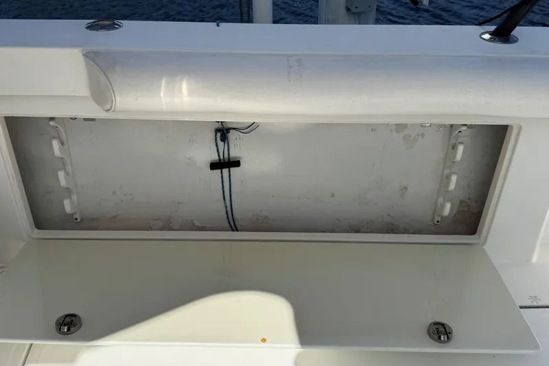 Slide: The Image of Open storage compartment on a 2008 Cabo 35 Flybridge boat. - 29