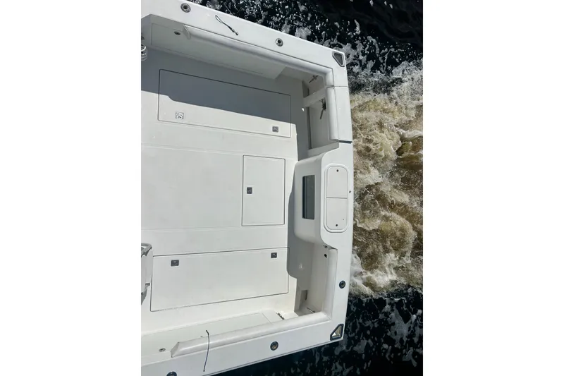 Slide: The Image of 2008 Cabo 35 Flybridge boat deck with ocean waves in the background. - 3