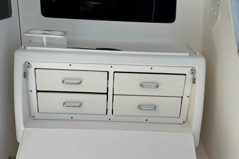 Slide: The Image of Interior storage drawers on a 2008 Cabo 35 Flybridge boat. - 33