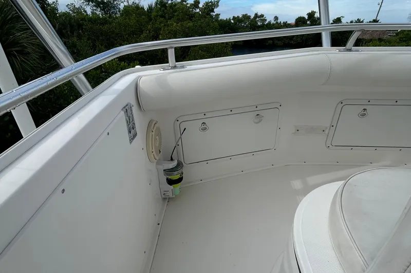 Slide: The Image of 2008 Cabo Yachts Sportfish 35 interior with white seating and storage compartments. - 4